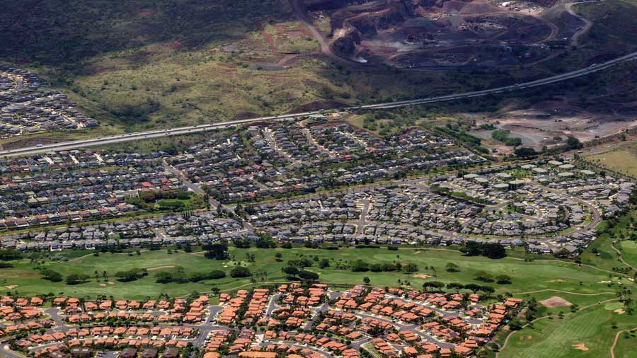 Aerial of Highway, Kapolei homes, golf course, and quarry on Oa