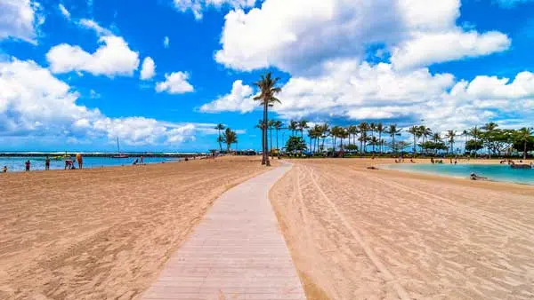 Waikiki shoreline with tourists in Honolulu, Hawaii