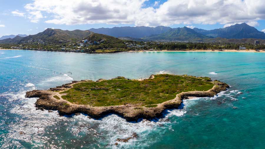 rocky island and Oahu coastline in Hawaii