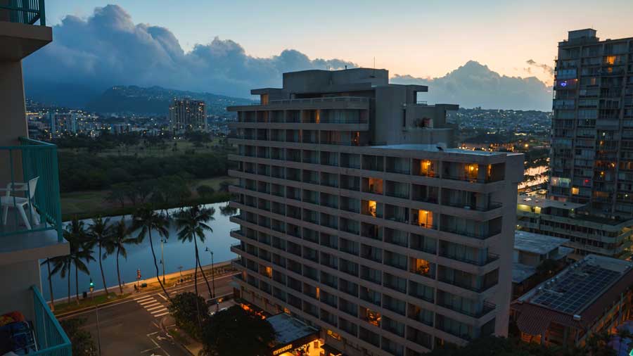 evening cityscape of Honolulu with mountains and canal view