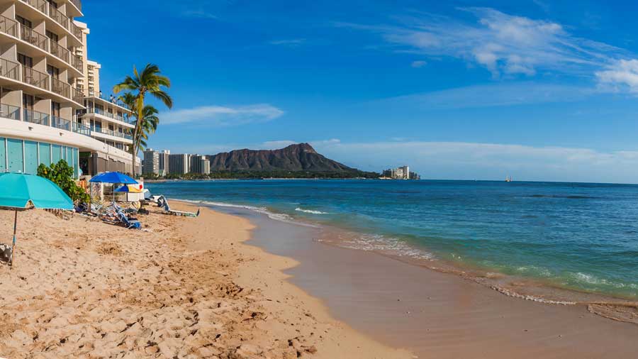 Waikiki beach with Diamond Head and modern beach front building