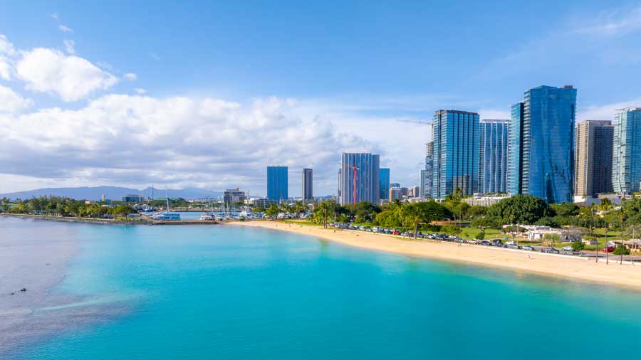 Honolulu coastline with high rise buildings and beach
