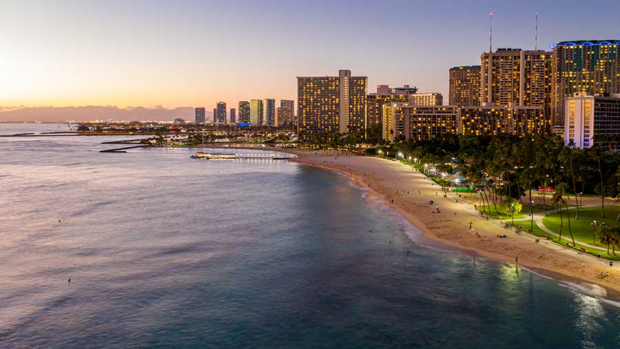 Waikiki beach towards Honolulu at sunset